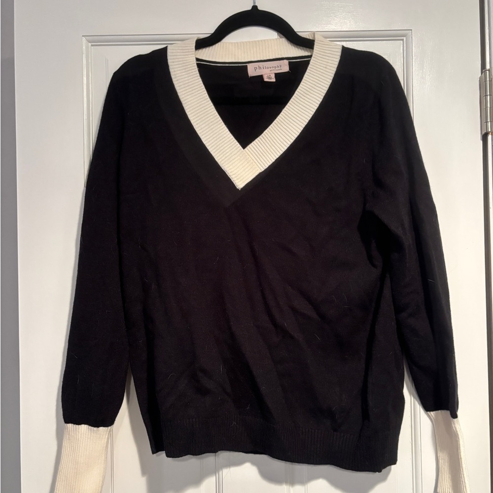 Black lightweight sweater 
with white trim
